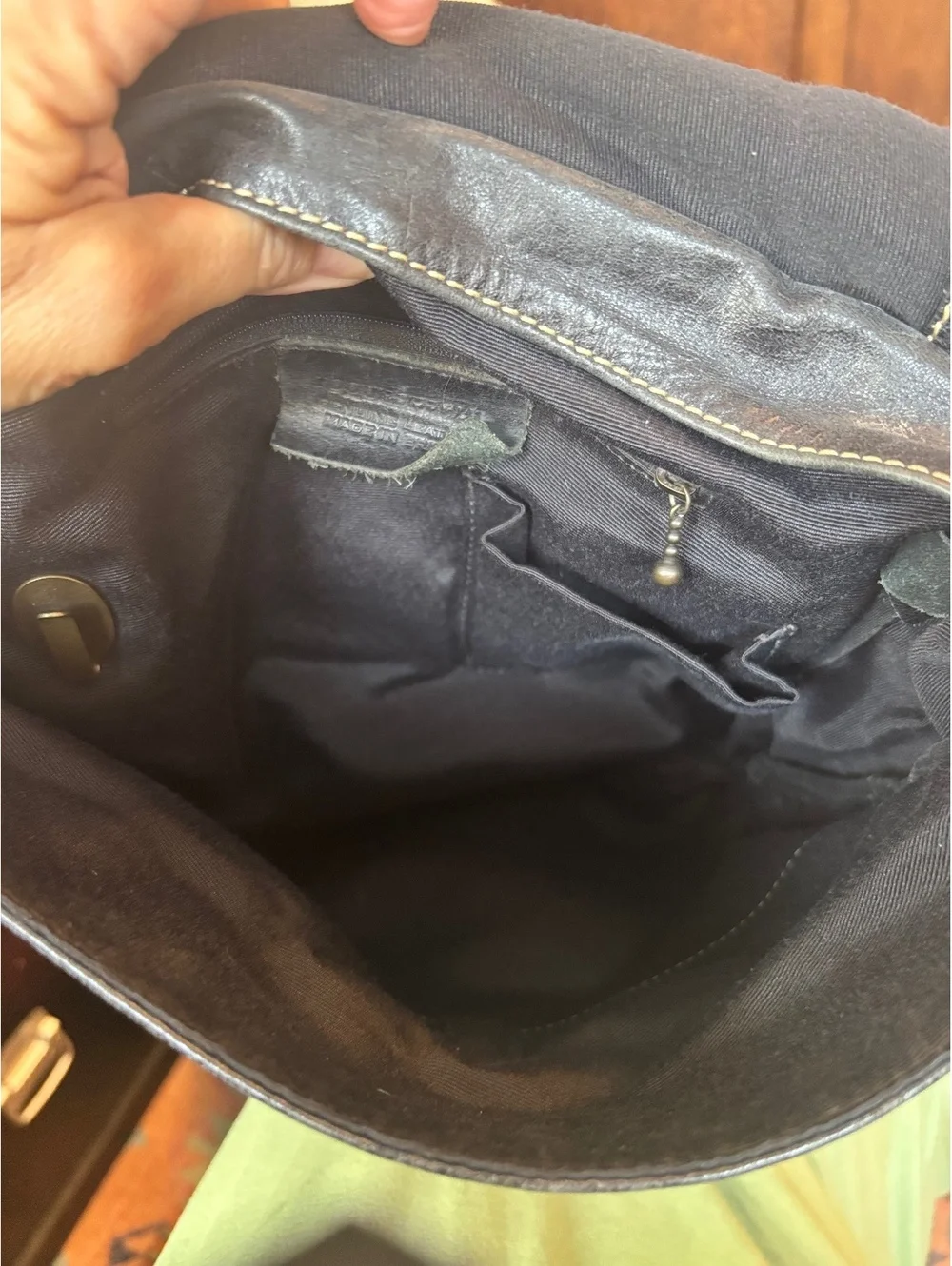Black Leather Crossbody Backpack with Buckle Closure